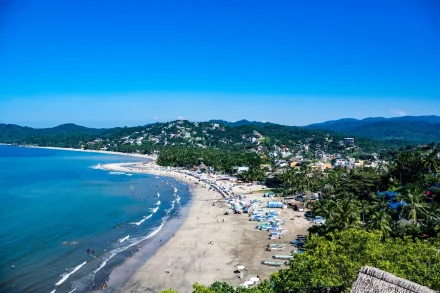 A breathtaking vista that captures the vibrant spirit of a tropical destination wedding. Where lush green hills meet golden sands and sparkling blue ocean waters, Puerto Vallarta offers an unforgettable backdrop for celebrating love in paradise