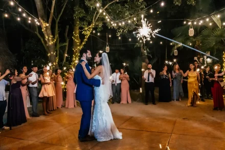 A dazzling first dance beneath a sky of light. Surrounded by glowing sparklers held by their loved ones, the newlyweds share an unforgettable, magical moment dancing together in the heart of Puerto Vallarta
