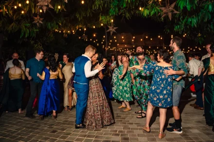 In the middle of a lively night full of music, laughter, and celebration, time stands completely still. Wrapped in the energy of everyone they love, the newlyweds share a quiet, romantic kiss right in the center of the dance floor in Puerto Vallarta