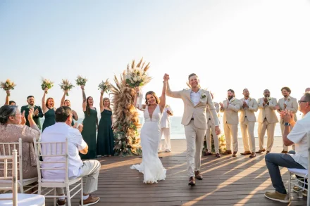 Hand in hand, stepping into forever amidst loud cheers, joyful smiles, and pure celebration. The exhilaration of walking back down the aisle as newlyweds under the warm golden sun of Puerto Vallarta