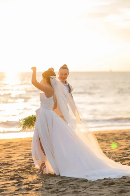 Unscripted laughter, warm sand between your toes, and the ocean breeze setting the rhythm. This spontaneous dance in the golden sunset light of Puerto Vallarta captures the pure, carefree bliss of celebrating your love story