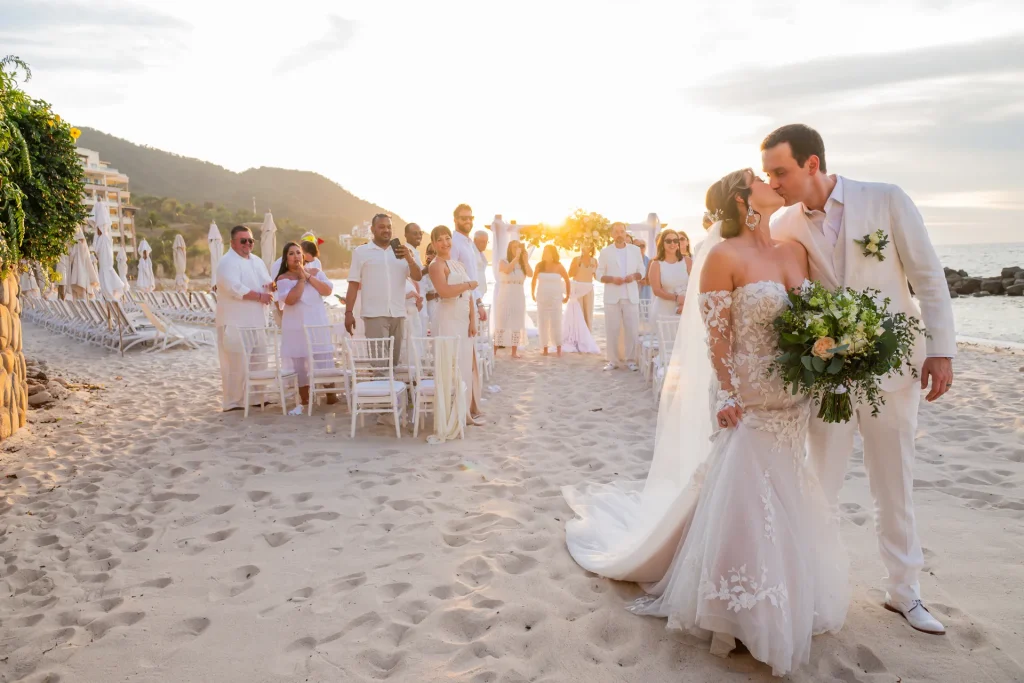 That first, unforgettable kiss as husband and wife, framed by a perfect golden hour sunset on the sand. Picture walking hand-in-hand, surrounded by your loved ones, with the Pacific Ocean as your witness. This is the moment where time stands still, creating a memory etched in gold on the shores of Puerto Vallarta