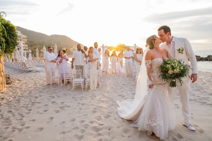 That first, unforgettable kiss as husband and wife, framed by a perfect golden hour sunset on the sand. Picture walking hand-in-hand, surrounded by your loved ones, with the Pacific Ocean as your witness. This is the moment where time stands still, creating a memory etched in gold on the shores of Puerto Vallarta