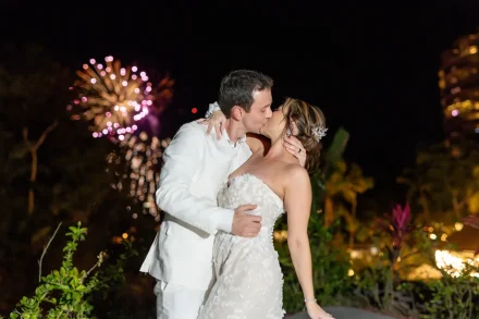 A truly grand finale. As vibrant fireworks light up the night sky, a romantic kiss captures the magic, excitement, and unforgettable celebration of two lives joining as one