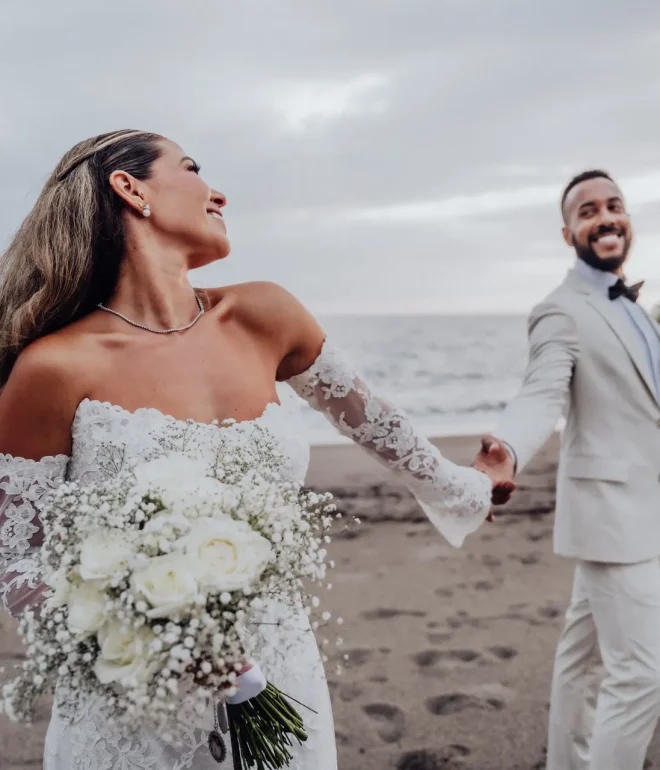 Pure happiness and effortless joy as they walk into forever together. Holding hands along the gentle shoreline, the bride beams with excitement, leading her groom through a beautiful sunset in Puerto Vallarta