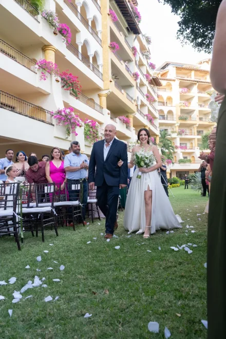 Walking arm in arm with your father toward the aisle is one of the most deeply touching moments of your wedding day. Surrounded by the warm smiles of your loved ones in sunny Puerto Vallarta, this walk is a memory to cherish forever