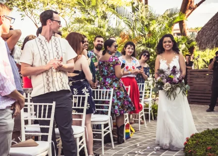 The priceless moment as all eyes turn to you. Walking down the aisle surrounded by the warm smiles and happy applause of your favorite people, holding your gorgeous bouquet as you take those unforgettable steps toward the love of your life in paradise