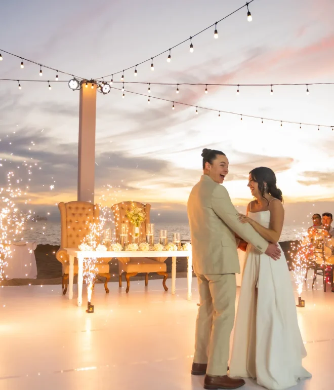 Sparkling lights, ocean breeze, and a dreamlike sunset setting the stage in Puerto Vallarta. Framed by brilliant cold fireworks and pure emotion, this first dance captures a magical, luminous moment you will treasure forever