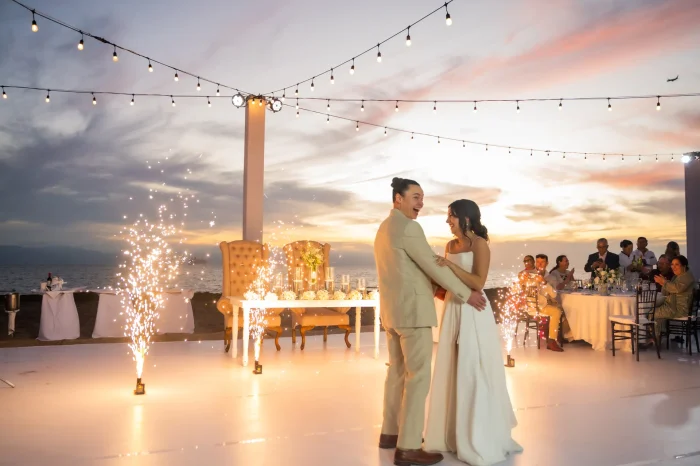 Sparkling lights, ocean breeze, and a dreamlike sunset setting the stage in Puerto Vallarta. Framed by brilliant cold fireworks and pure emotion, this first dance captures a magical, luminous moment you will treasure forever