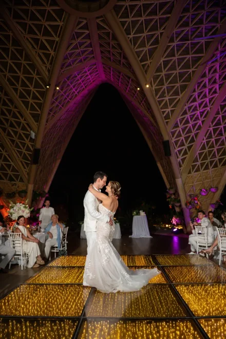 Their very first dance as husband and wife, floating on a sea of golden lights. Framed by breathtaking bamboo architecture and romantic ambient lighting, this magical moment sets the perfect stage for an extraordinary night of celebration