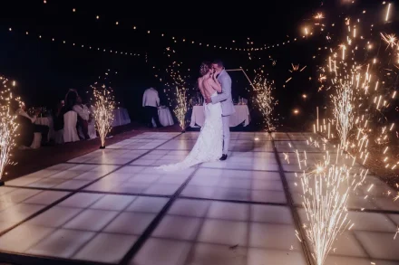 A truly magical moment framed by sparks and starlight. Your first dance as husband and wife transforms into a breathtaking spectacle under the night sky of Puerto Vallarta, igniting romance and setting the tone for a celebration you'll remember forever