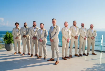 Standing tall by the ocean's edge with lifelong brothers by his side. A refined moment of camaraderie, confidence, and quiet support before walking down the aisle in beautiful Puerto Vallarta
