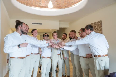 The moments leading up to the aisle are filled with pure joy and camaraderie. A toast with your best friends to settle the nerves, share laughter, and celebrate the start of the most unforgettable day in Puerto Vallarta