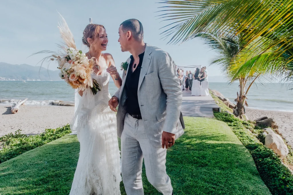 Pure bliss in every step as husband and wife. Unscripted laughter, radiant joy, and the tropical breeze setting the mood for those legendary first moments after saying 'I do' by the ocean in Puerto Vallarta