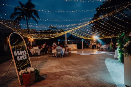 A starlit celebration beneath a sparkling canopy of fairy lights. With an inviting dance floor, elegant guest tables, and a illuminated mirror seating chart, this magical evening reception sets the stage for an unforgettable night in Puerto Vallarta