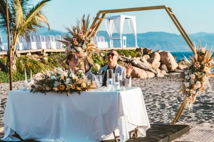 Celebrating your first moments as newlyweds with sand beneath your feet and golden-hour warmth all around. A beautifully styled sweetheart table overlooking the Pacific creates an enchanting space for heartfelt toasts, genuine smiles, and unforgettable reception memories in Puerto Vallarta