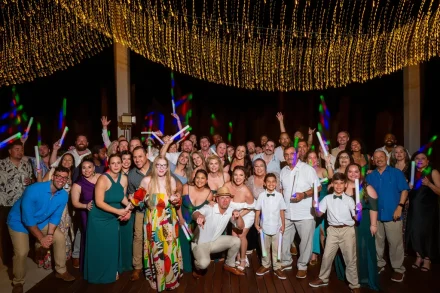 An unforgettable gathering of everyone who made the night special. Smiling faces, flashing lights, and shared joy come together for the ultimate celebration photo under the stars in Puerto Vallarta
