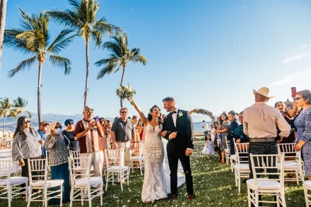 Just married! Walking down the aisle arm-in-arm as husband and wife beneath bright tropical skies, surrounded by floating bubbles and the joyful cheers of your favorite people, captures the pure triumph and magic of your Puerto Vallarta wedding recessional