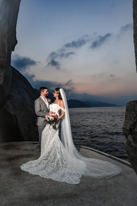 Nestled between dramatic stone formations and the deep twilight blue of the Pacific, this is pure coastal romance. A timeless portrait capturing the quiet strength and intimate elegance of your Puerto Vallarta destination wedding