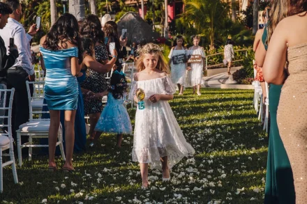 A magical entrance filled with wonder and joy. Floating bubbles and a pathway strewn with white petals make every step down the aisle feel like a fairytale moment in Puerto Vallarta