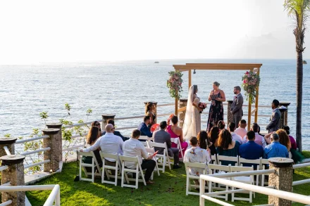 Surrounded by your closest loved ones with the gentle sound of ocean waves soft against the shore. Taking your vows under the open sky, framed by floral accents and sparkling waters, creates an unforgettable, serene backdrop for your dream Puerto Vallarta wedding