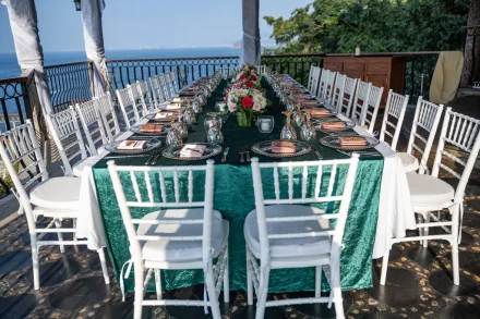 A masterpiece of romance waiting for your guests. With deep emerald velvet, delicate blush florals, and the vast Pacific ocean stretching into the horizon, this stunning table setup sets the scene for an unforgettable, intimate dinner under the coastal breeze in Puerto Vallarta