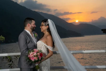 Bathed in the warm, golden glow of a Pacific sunset, this tender gaze speaks louder than words. As the sun dips behind the majestic mountains, your love story shines brightest, leaving you with an unforgettable moment frozen in time in Puerto Vallarta