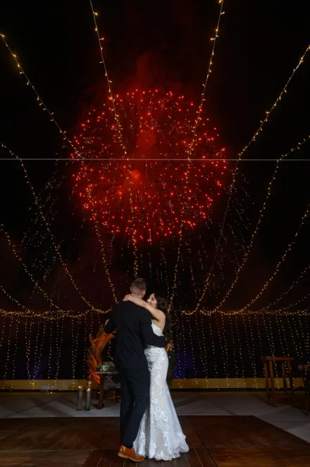 A breathtaking grand finale lit up by a burst of pure magic. Dancing together under string lights as brilliant red fireworks illuminate the night sky, this spectacular moment turns your Puerto Vallarta wedding reception into an unforgettable celebration